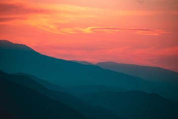 Fototapeta na wymiar Sun setts over Caucasus Mountains. Joyful motivational bright colorful image. Georgia 