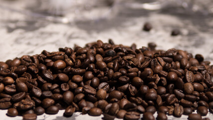 A pile of roasted coffee beans on a black and white background, close-up, space for text, Wallpaper, background, texture