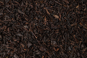 Dry tea leaves background or texture, black tea pattern - obrazy, fototapety, plakaty