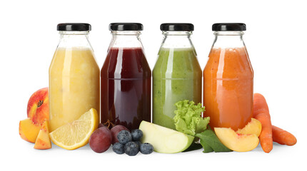 Bottles of delicious juices and fresh fruits on white background