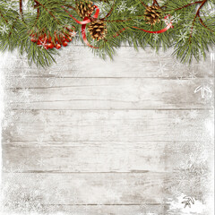 Vintage christmas wood background with branches, holly and cones. Christmas greeting card with copy-space