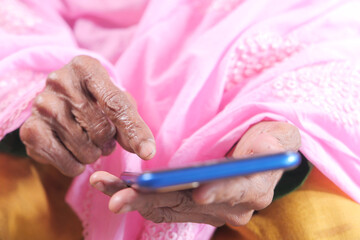  senior women hand using smart phone close up 