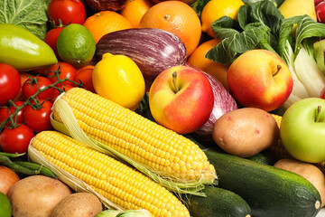 Assortment of fresh organic fruits and vegetables as background, closeup