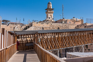 Fototapeta premium Bab al-Silsila minaret and Wooden Mughrabi Bridge, a wood bridge connecting the Western Wall area with the Mughrabi Gate of the Temple Mount in Jerusalem, Israel