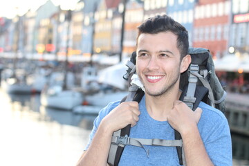 Ethnic backpacker walking around Denmark