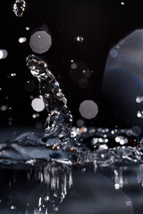 Fototapeta na wymiar Macro capture of droplets reaching a water surface
