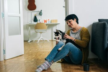 woman with her puppy husky at home