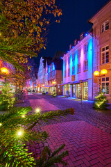 Fototapeta na wymiar The city center of Osnabrück with its christmas decorations and lights during the evening