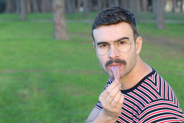 Man with very long and elastic tongue