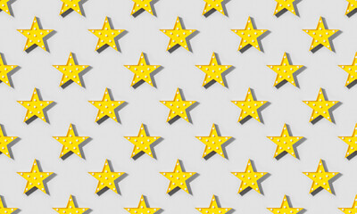 Seamless pattern of Yellow lamp as star with LED lights with shadow on gray background. Trendy...
