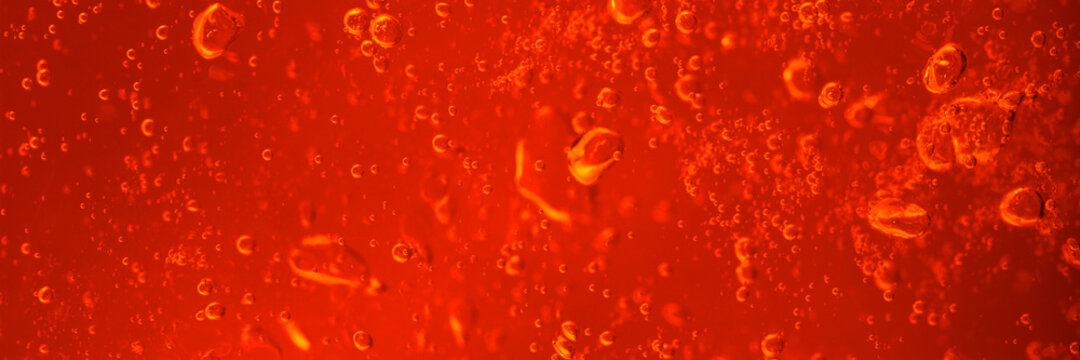 Air bubbles in red jelly