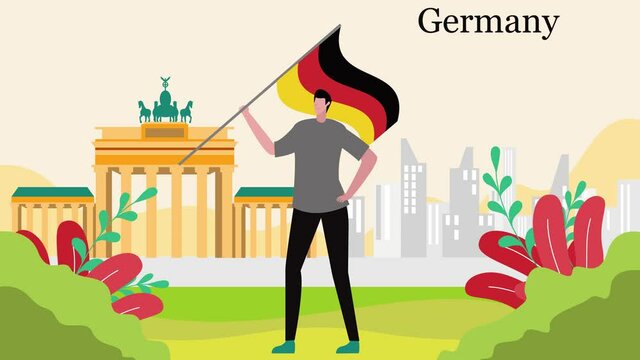 Man waving German flag near Brandenburg gate