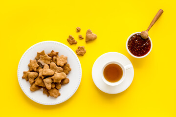 Tea with cookies and berry jam at home top view