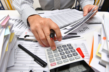 business concept - businessman working with reports in office, table and workspace close view,...