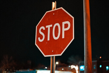 Stop Sign In A Dark Parking Lot At Night