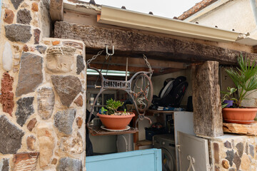 The pot with a plant in a suspension made from a bed from a Singer sewing machine in the Muslim...