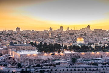 Fototapeta premium Old city of Jerusalem on the temple mount under beautiful sunset in the evening with golden dome of the rock, sunset view from the Mount of Olives
