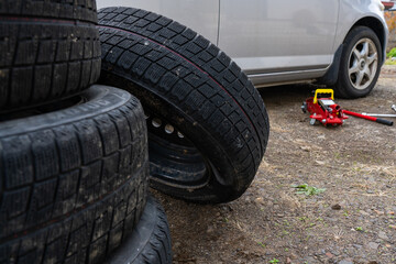 Vehicle tire repair and replacement equipment. Seasonal tire change.