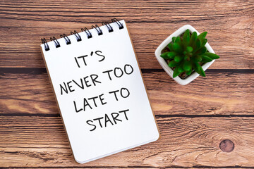 Inspirational quotes on note pad - Its never too late to start.