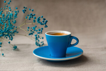 Espresso coffee in a blue mug