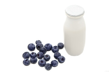 Natural yogurt with probiotics and Lactobacillus in small plastic bottle and Blueberry on white background. Healthy diet food, dairy products with fruit and berry additives. 