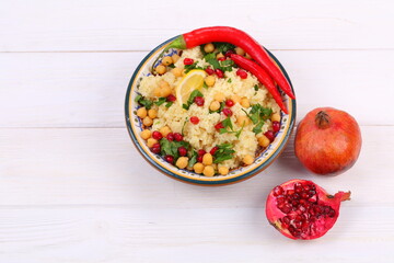 Eastern dish couscous with pomegranate and chickpeas
