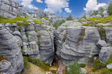 Landscape with rocks and small waterfalls in the black lagoon of the town of Neila, Las calderas,...