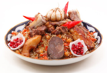 Cooking pilau in the kitchen of an oriental restaurant. Pulls out a piece of lamb