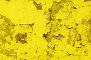 Photo background of old cracked plaster. Grunge background. illuminating color of the year 2021