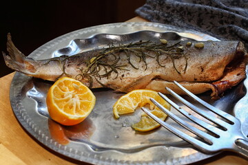 Pink salmon cooked in the oven with lemon and rosemary