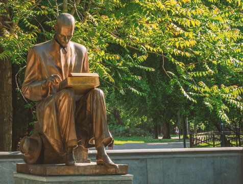 gilded bronze monument to the journalist Indro Montanelli in the Public Gardens of Porta Venezia while he is writing on his Olivetti Lettera 22 typewriter.Milan, Italy