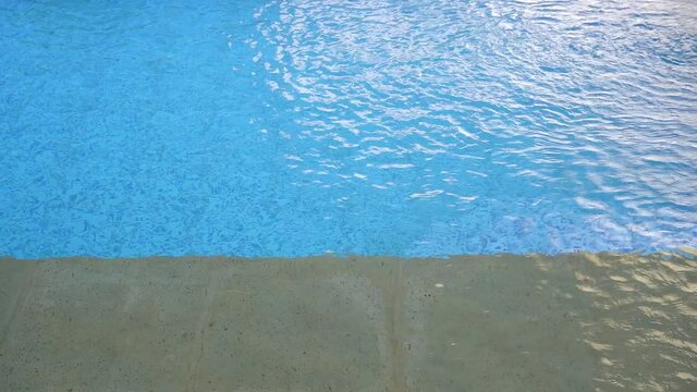 The water swirling on the surface of a swimming pool
