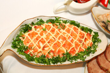 Salad with salmon on a festive served table
