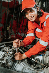 Fototapeta na wymiar portrait of young asian man repairing a broken car engine part