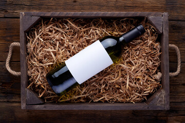 White wine bottles packed in open wooden box