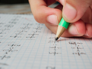 Girl doing homework, just hand shown, close up look