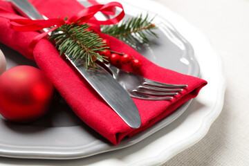 Festive table setting with beautiful dishware and Christmas decor on white background