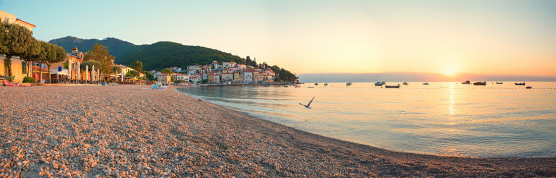 deserted beach Moscenicka Draga, seascape in the morning mood with rising sun
