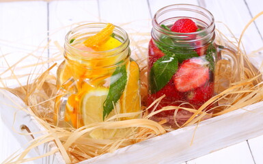 Fruit smoothies on a white wooden table