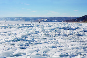 Fototapeta na wymiar Beautiful landscape of frozen Lake Baikal on a winter day. Fields of ice hummocks in the village of Listvyanka