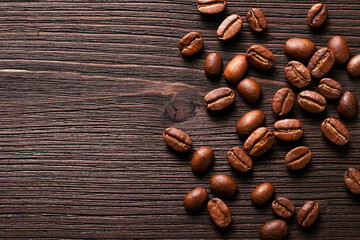 Aromatic coffee Beans on a wooden table with copy space. Rustic style