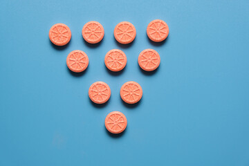 Vitamin c word on blue background.