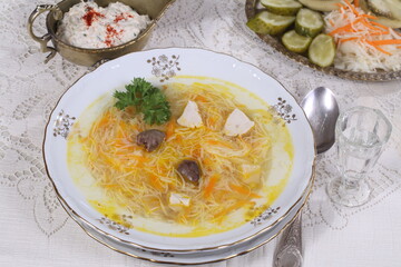 Chicken soup with noodles and hearts
