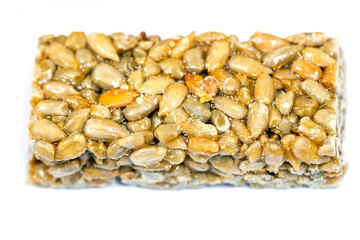 Bars with various nuts and seeds in sweet syrup closeup