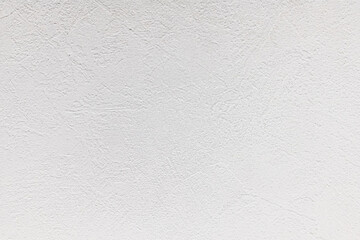 White concrete background with abstract textured pattern applied to the surface
