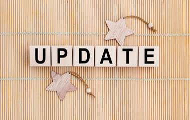 Wooden cubes with the abbreviation UPDATE