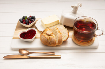 Breakfast with a Cup of tea, bread, butter and jam 