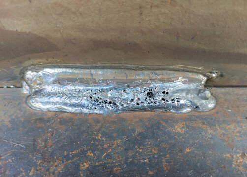Porosity or worm hole in weld, Defect of welding process Flux Cored Arc Welding (FCAW)