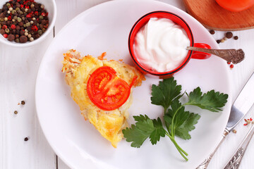 A dish of zucchini, baked with tomatoes and cheese