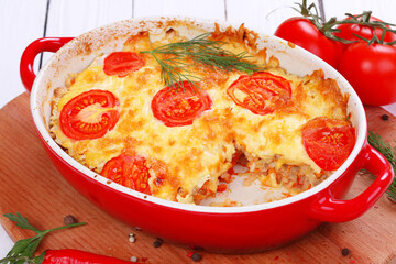 A dish of zucchini, baked with tomatoes and cheese
